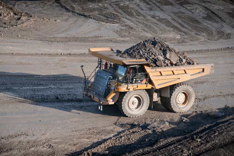 Dumper containing rocks at surface coal mine, high angle