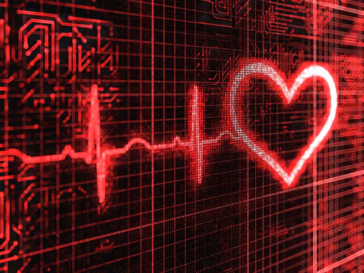 Closeup of a digital pulse and heart background