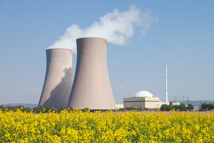 Nuclear power plant with steam cooling tower and rapeseed field