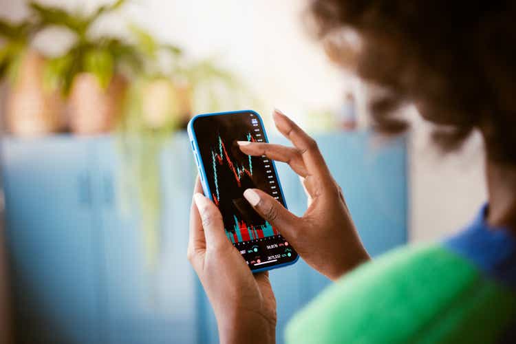 Woman looking at stock charts