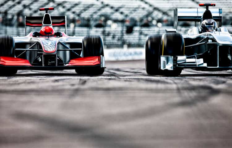 Race cars driving on track