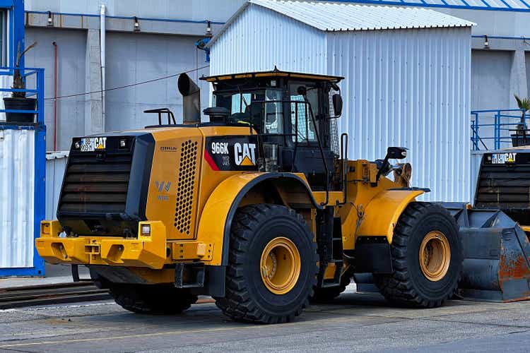 Caterpillar 966K wheel loader stands near a wall in Batumi.