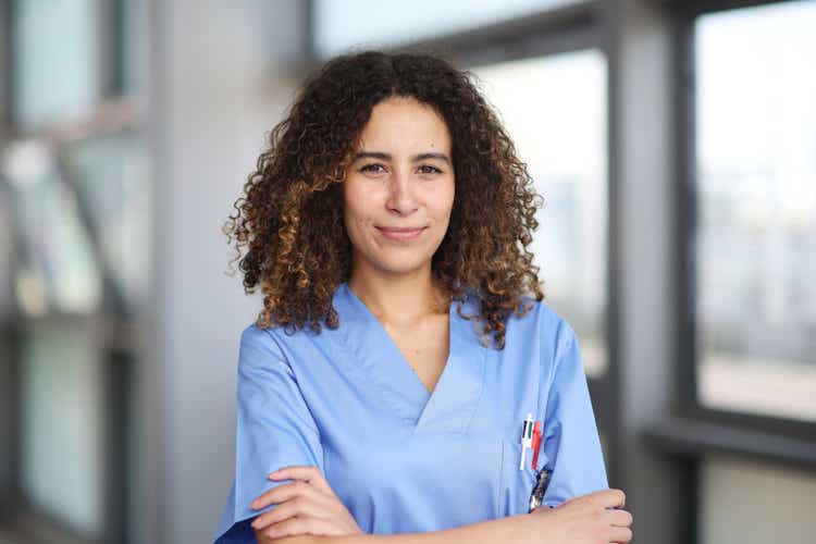 Nurse posing in a hospital hallway