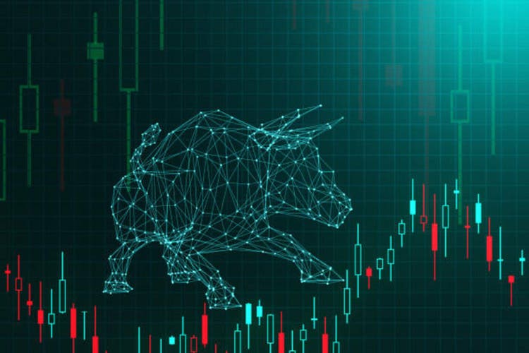 Bull in wireframe in front of candlestick charts of stock prices on dark background. Illustration of the concept of bull market