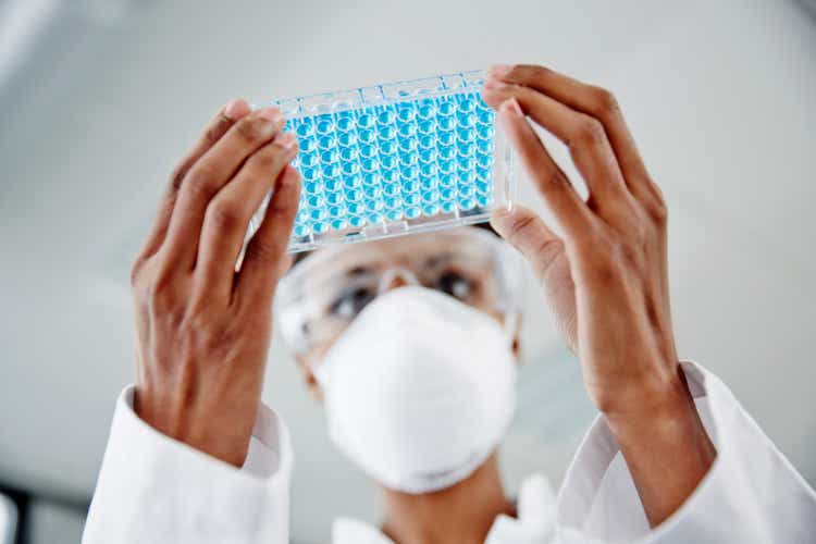 Woman examining laboratory samples