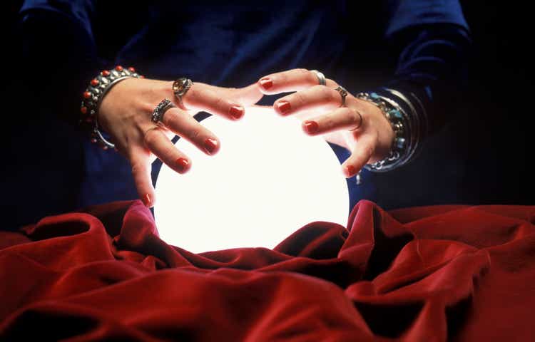 hands on glowing crystal ball