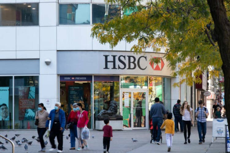 People walk by an HSBC bank branch in downtown Toronto.