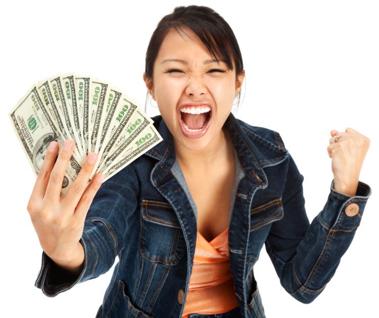 Excited Young Woman Holding Money