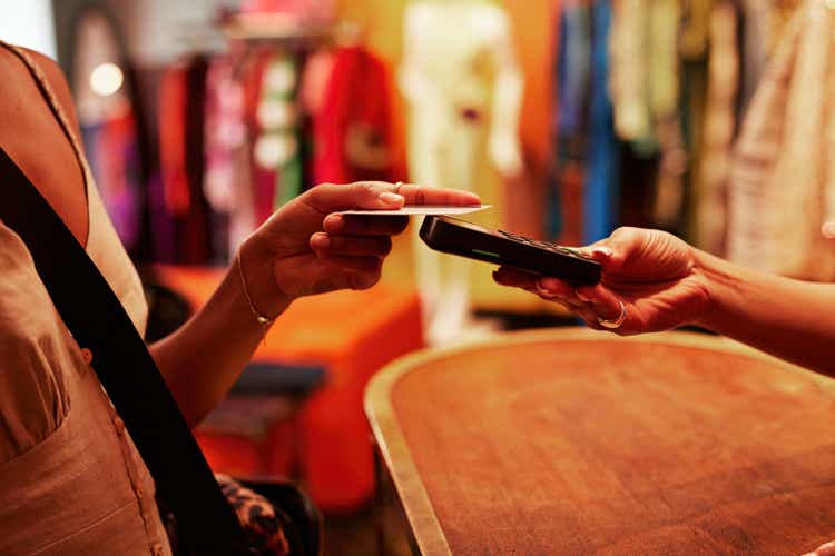 Woman paying through credit card in store