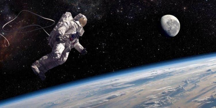 Astronaut In Tethered Spacewalk Over Earth