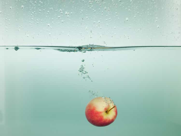 Apple splashing in water