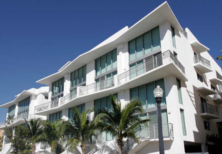 White South Beach condo with palm trees