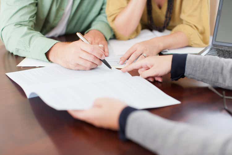 Husband and wife sign contract