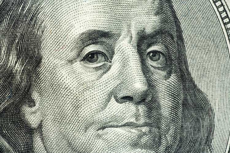 Closeup portrait of Benjamin Franklin on hundred dollar bill