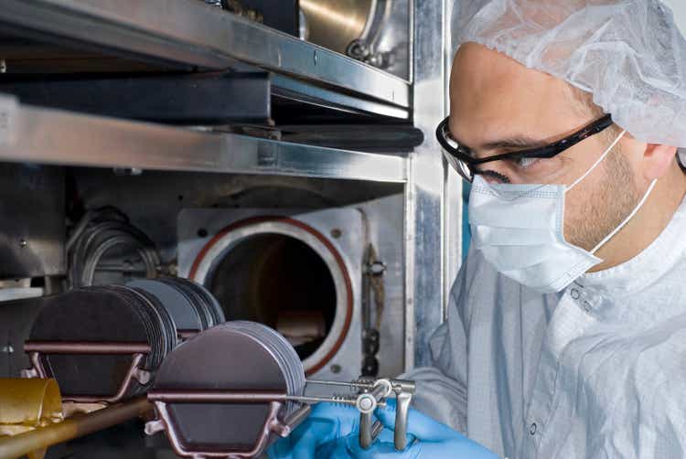 Technician Working with Silicon Wafers