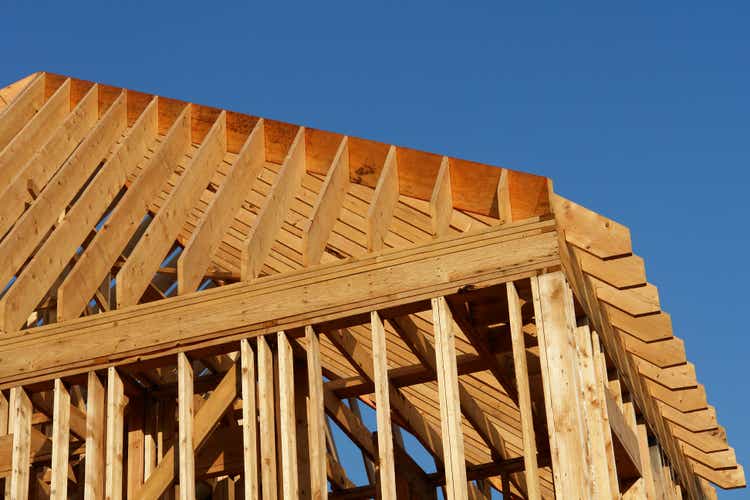 wooden house frame against blue sky