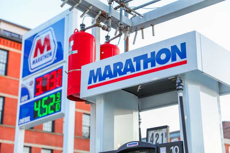 Boston, MA, USA, October, 7th 2023, Marathon gas station with towering fuel prices displayed on a digital sign, illustrating the impact of rising inflation on everyday costs