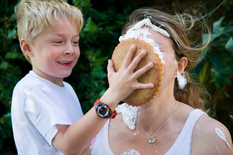 child hits mummy with custard pie