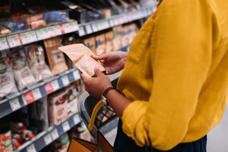 An Unrecognizable Woman Shopping At The Supermarket