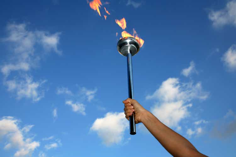 glory of holding flaming torch