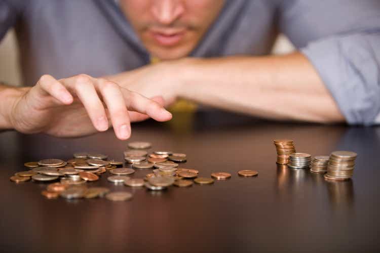 Counting or sorting coins, with 4 piles of different types