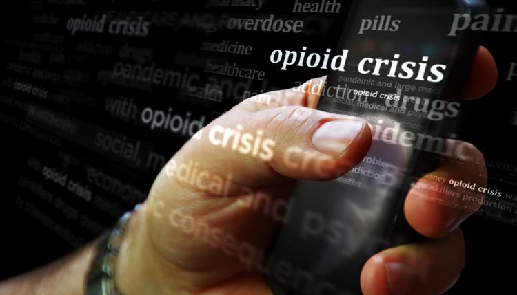 Opioid crisis painkiller epidemic news titles on screen in hand 3d illustration