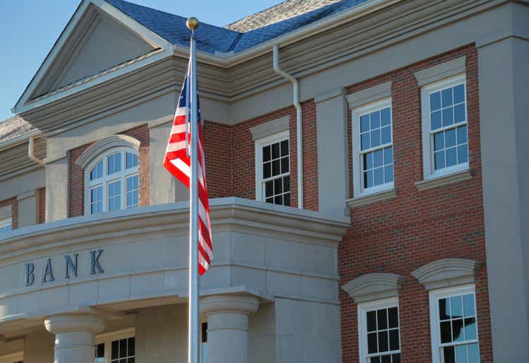 Outside view of a bank with American flag