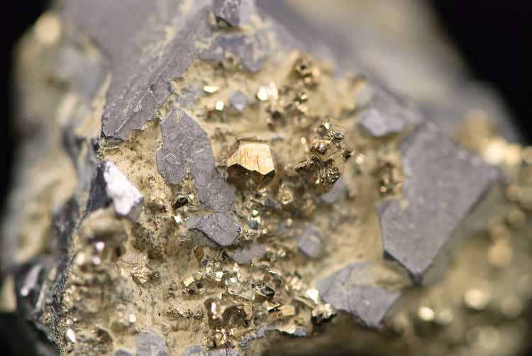 Macro picture of a raw golden nugget found on a mine