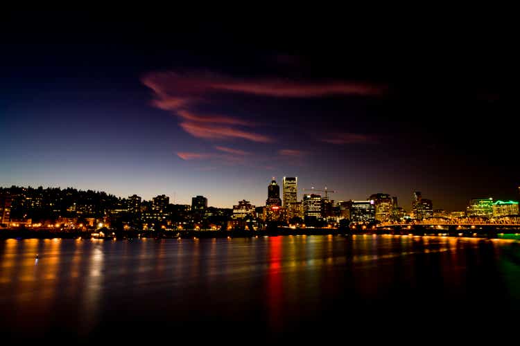 Wispy clouds over Portland, Oregon skyline at night