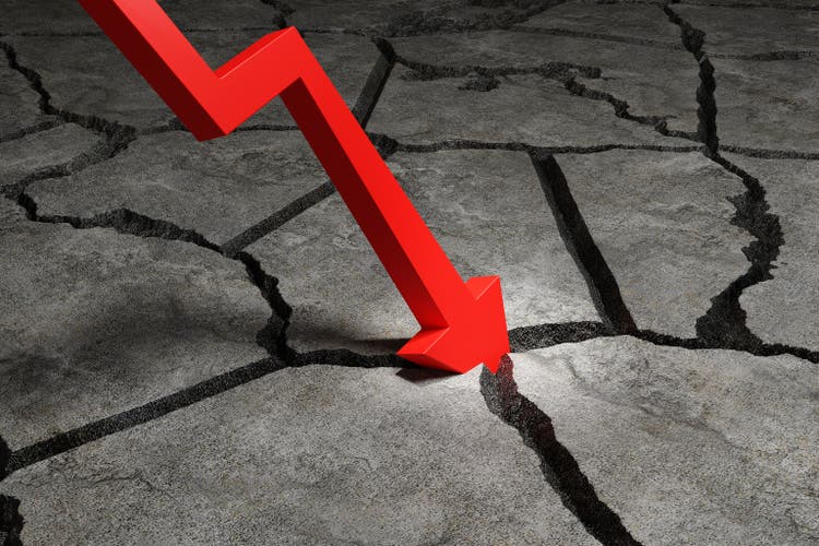 Red down arrow crashes the concrete ground. Illustration of the concept of price drop of stocks and economic recession