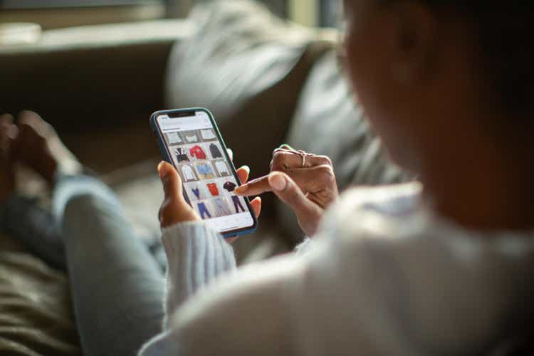 Woman purchasing clothes on a mobile app