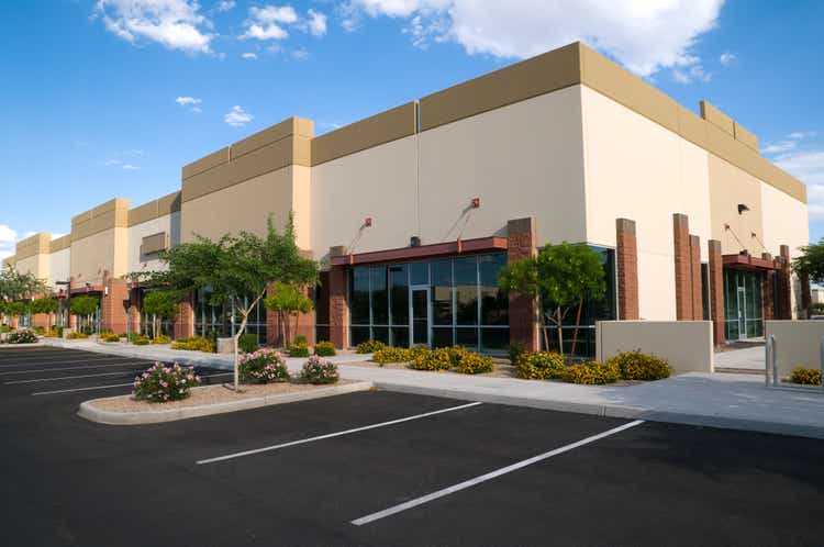 Bright colored photo of parking lot and office building