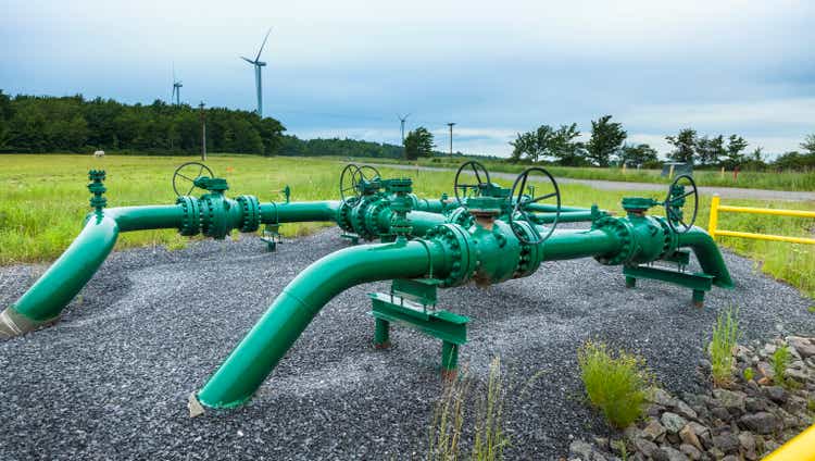 Green Marcellus shale gas pipelines in grass field
