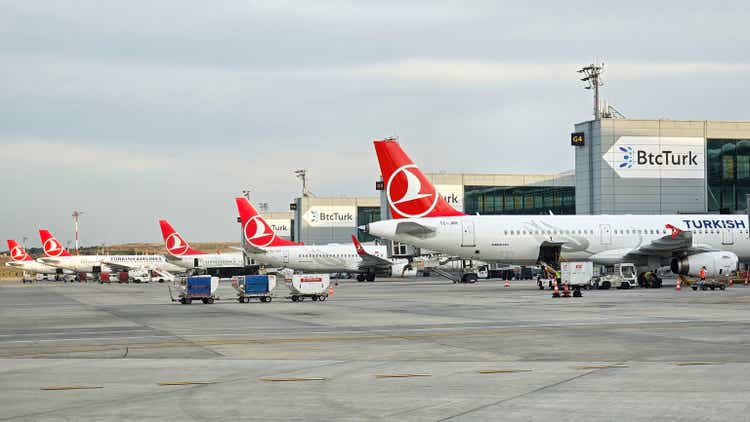 Several Turkish Airlines planes parked at the Istanbul airport terminal