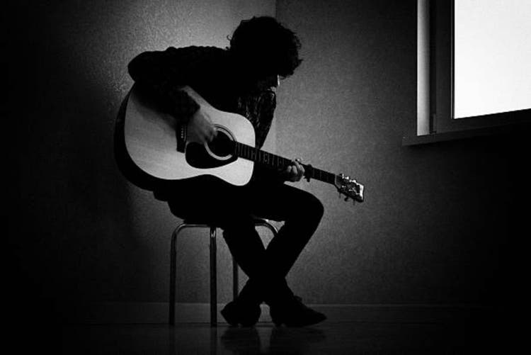 Black and White Photo of the guitar playing