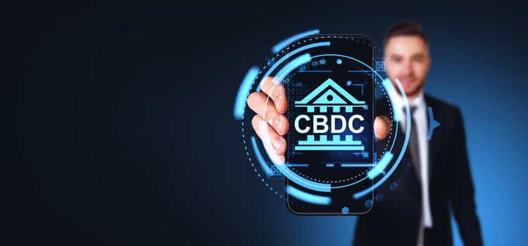 Man showing smartphone with CBDC icon