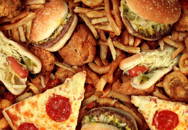 Fast food items like hot dogs, hamburgers, fries and pizza