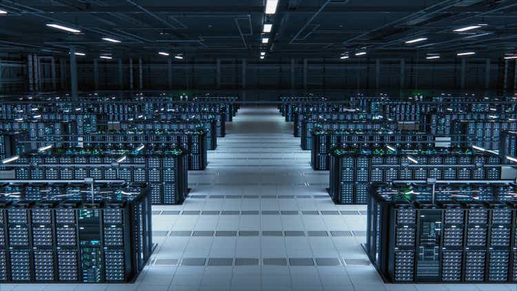 Modern Data Technology Center Server Racks Working in Well-Lighted Room. Concept of Internet of Things, Big Data Protection, Storage, Cryptocurrency Farm, Cloud Computing. Mining Facility Warehouse.