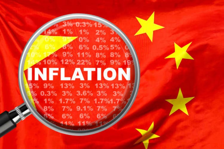 Loupe focused on the word inflation on China flag background. Inflation, tax, financial concept in China