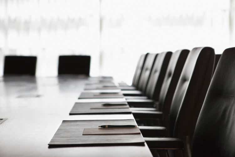 Folders and pens on meeting table