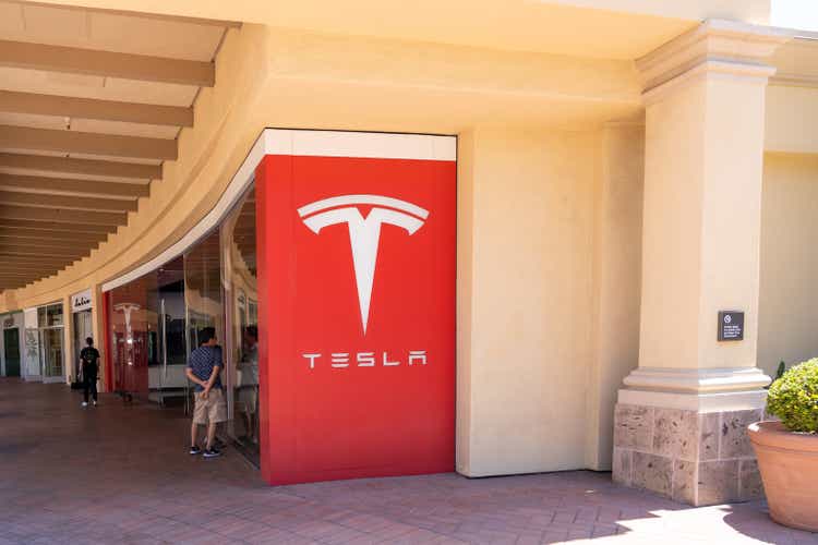 Tesla store sign is shown in Newport Beach, CA, USA.