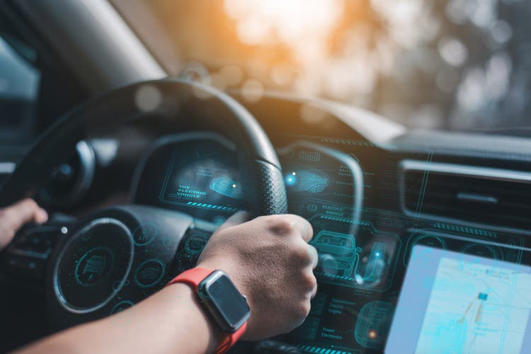 A future automobile and a graphic user interface (GUI). smart car linked car The Internet of Things the HUD, or head-up display