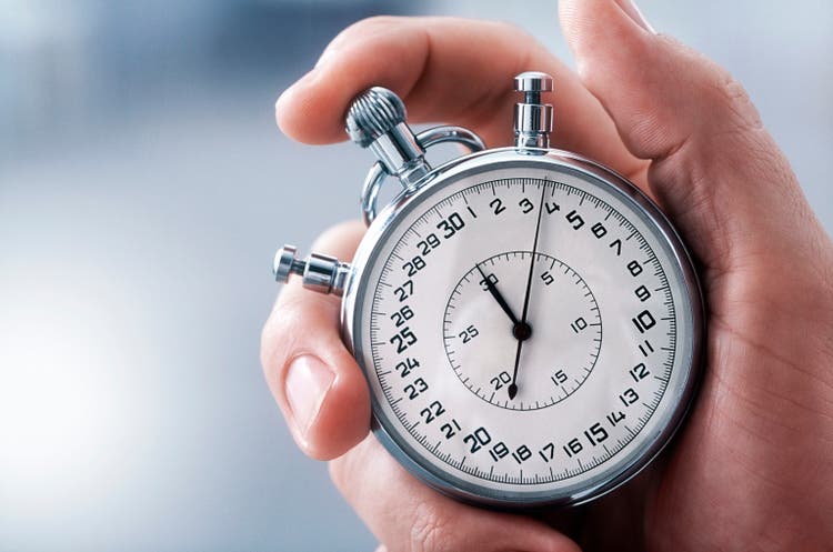 hand with classic stopwatch