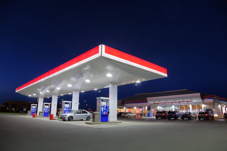 Car Refueling at Gas Station during the Night