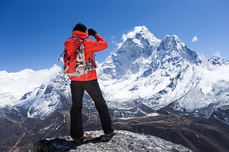 Woman looking at Ama Dablam, Mount Everest National Park, Nepal