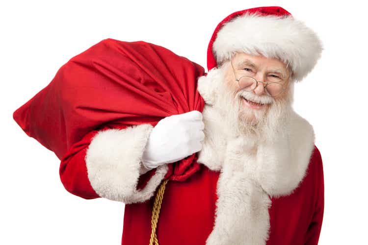 Pictures of Real Santa Claus Carrying A Gift Bag