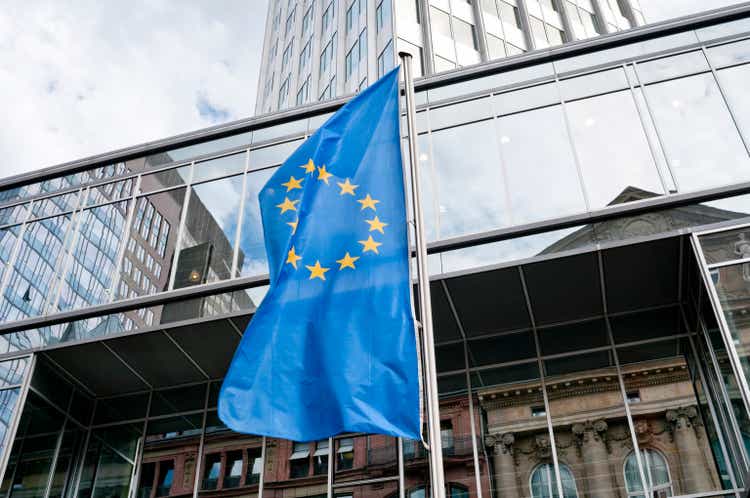 European Union flag in front of the Eurotower in Frankfurt