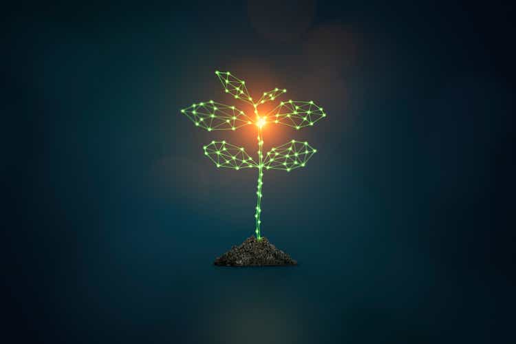 New life Artificial intelligence concept glowing plant on dark background