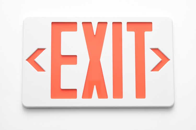 Emergency exit signs on white wall