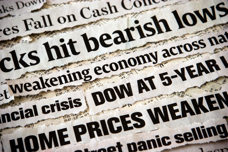 Economic headlines surrounding each other